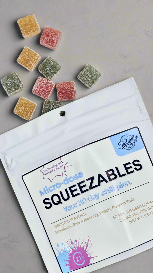 Packaging of Squeezzables with colorful gummy cubes on a white background