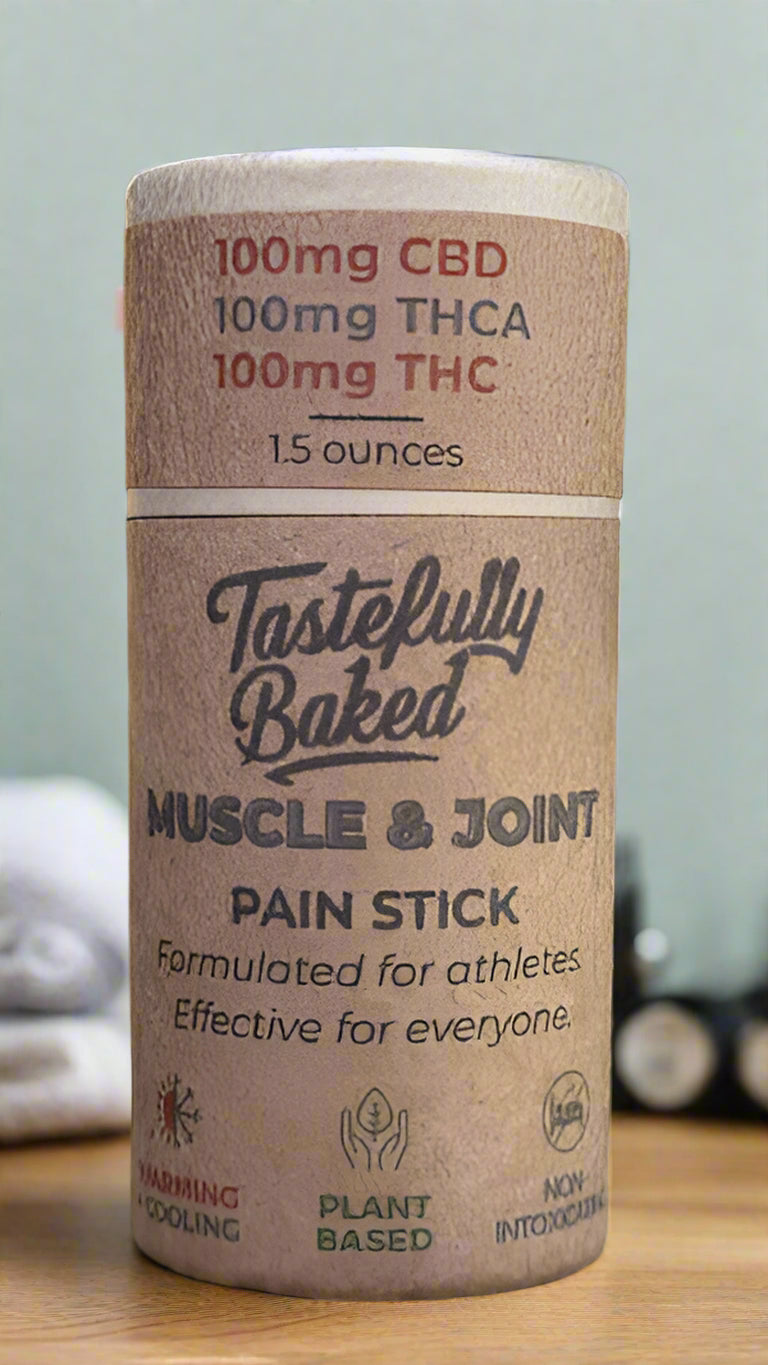 Tastefully Baked muscle and joint pain stick with CBD content on a natural background
